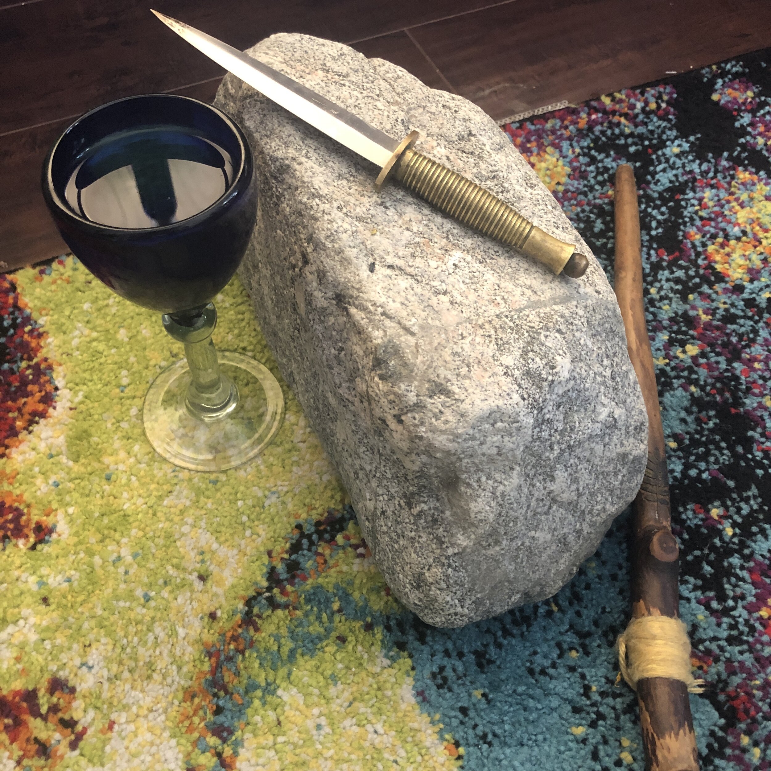 My working tools: The Cup of Compassion, the Athame for Truth, the Stone of Sovereignty, and the Wand of Victory. They are Love, Life, Law, Light.